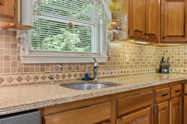 175 Buck N Doe Trl, Augusta, ME 04330 - kitchen with backsplash, light stone countertops, and brown cabinets
