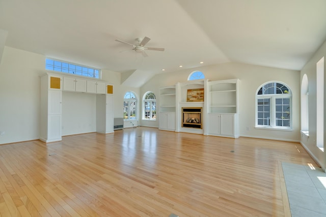 9 Riverside Ave, Saco, ME 04072 - unfurnished living room featuring lofted ceiling, a ceiling fan, light wood-style flooring, and a fireplace