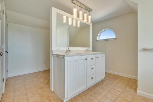 9 Riverside Ave, Saco, ME 04072 - full bathroom featuring double vanity, vaulted ceiling, and tile patterned floors