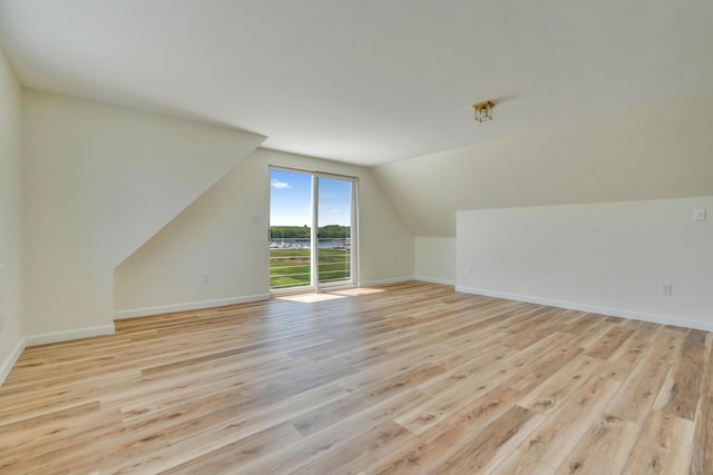 9 Riverside Ave, Saco, ME 04072 - additional living space with light wood-style flooring and lofted ceiling