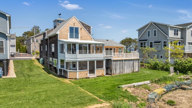 9 Riverside Ave, Saco, ME 04072 - rear view of property with a sunroom, a yard, and a shingled roof