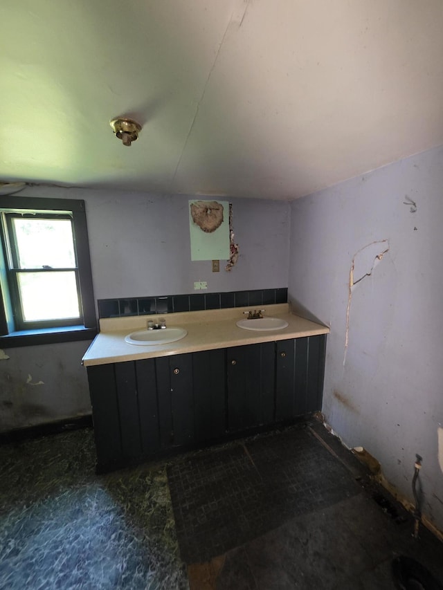 67 Back Searsport Rd, Searsport, ME 04974 - bathroom with double vanity and tasteful backsplash