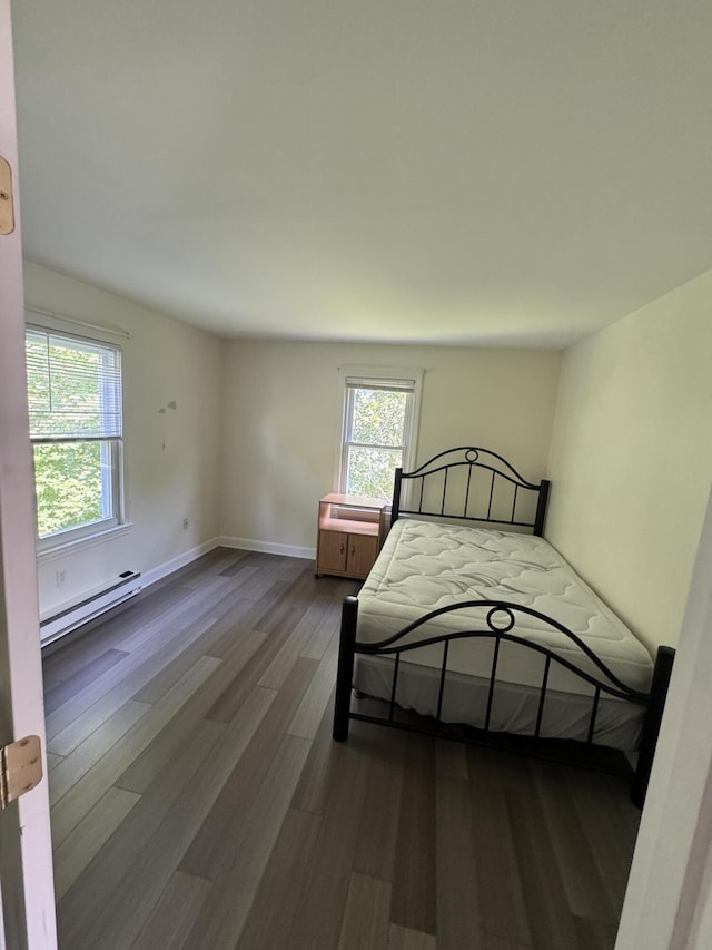 25 Minott St Unit 9, South Portland, ME 04106 - bedroom featuring a baseboard radiator and dark wood-style flooring