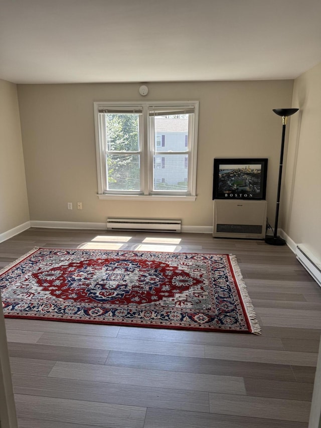 25 Minott St Unit 9, South Portland, ME 04106 - living area featuring a baseboard radiator and wood finished floors
