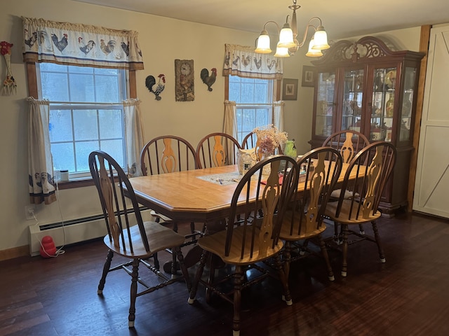 142 Abbott Rd, Albion, ME 04910 - dining area with plenty of natural light, a chandelier, a baseboard radiator, and wood finished floors