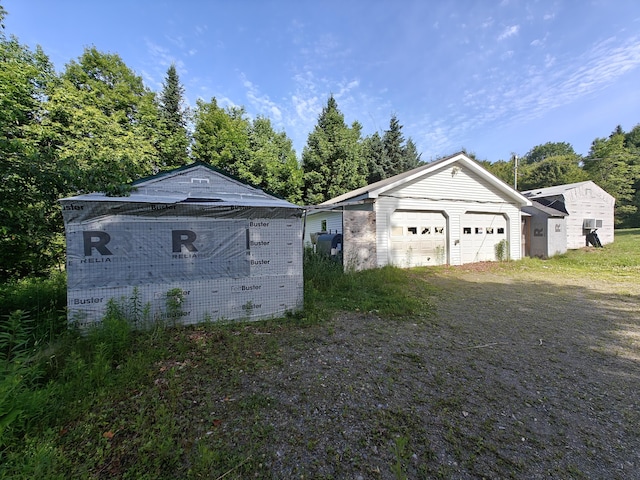 1052 Douty Hill Rd, Sangerville, ME 04479 - view of home's exterior featuring an outdoor structure and brick siding