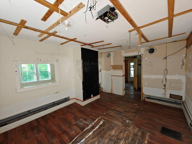 1052 Douty Hill Rd, Sangerville, ME 04479 - unfurnished living room with hardwood / wood-style flooring and a baseboard radiator