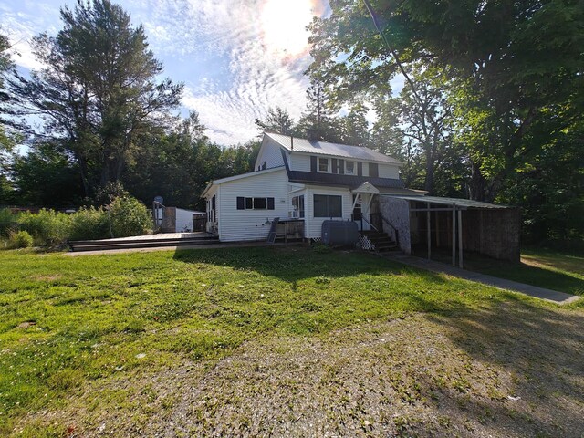 1052 Douty Hill Rd, Sangerville, ME 04479 - view of front facade with a front yard and a wooden deck