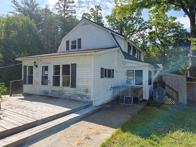 1052 Douty Hill Rd, Sangerville, ME 04479 - rear view of property with a gambrel roof and a wooden deck