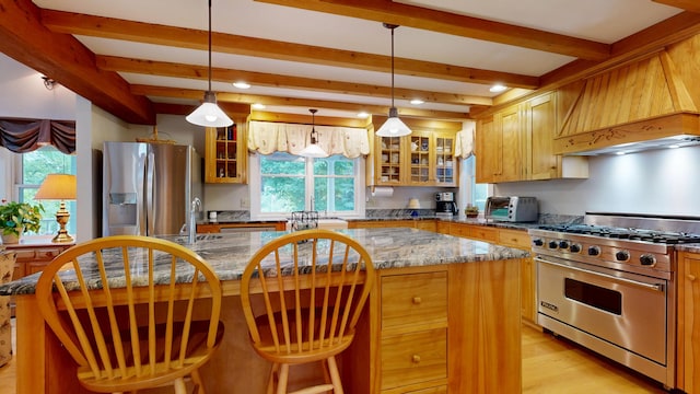 486 Webbs Mills Rd, Raymond, ME 04071 - kitchen featuring stainless steel appliances, a center island, beamed ceiling, light wood-type flooring, and glass insert cabinets
