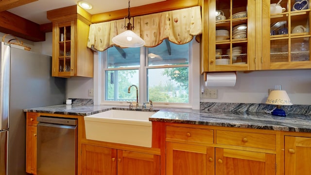 486 Webbs Mills Rd, Raymond, ME 04071 - kitchen featuring stainless steel appliances, brown cabinets, pendant lighting, glass insert cabinets, and dark stone counters