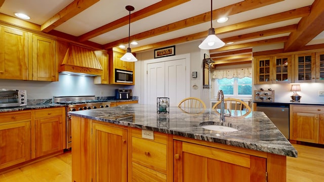 486 Webbs Mills Rd, Raymond, ME 04071 - kitchen with appliances with stainless steel finishes, premium range hood, beamed ceiling, a center island with sink, and light wood finished floors