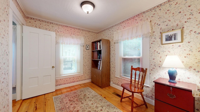 486 Webbs Mills Rd, Raymond, ME 04071 - sitting room with ornamental molding, wood-type flooring, and wallpapered walls