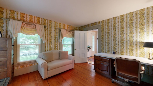 486 Webbs Mills Rd, Raymond, ME 04071 - office area featuring wallpapered walls, light wood finished floors, healthy amount of natural light, and built in desk