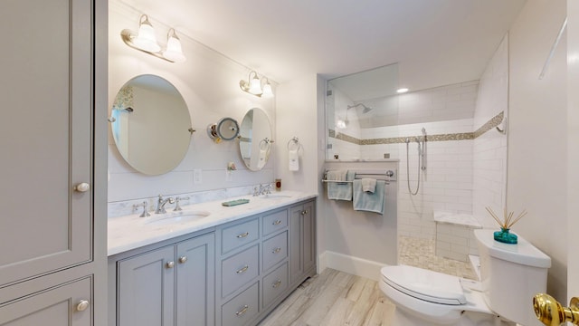 486 Webbs Mills Rd, Raymond, ME 04071 - bathroom with double vanity, walk in shower, and wood finished floors