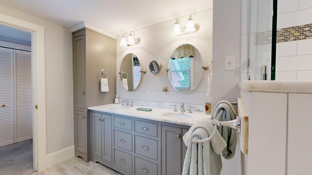 486 Webbs Mills Rd, Raymond, ME 04071 - bathroom featuring a closet and double vanity