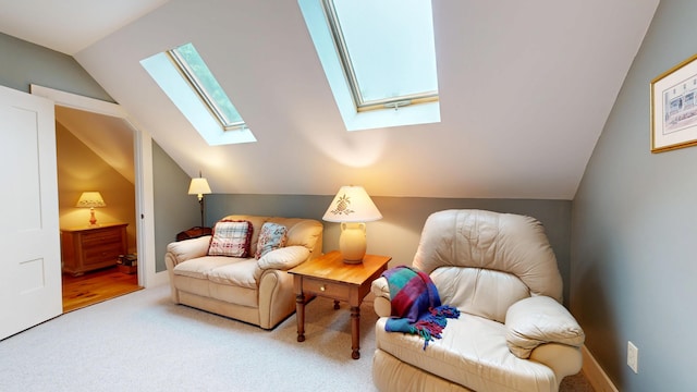 486 Webbs Mills Rd, Raymond, ME 04071 - living area featuring a skylight, vaulted ceiling, and carpet flooring