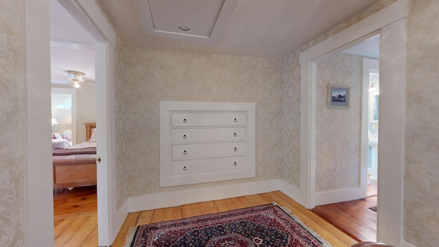 486 Webbs Mills Rd, Raymond, ME 04071 - hall featuring hardwood / wood-style flooring, attic access, and wallpapered walls