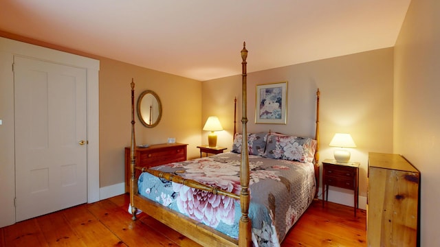 486 Webbs Mills Rd, Raymond, ME 04071 - bedroom with hardwood / wood-style flooring and baseboards