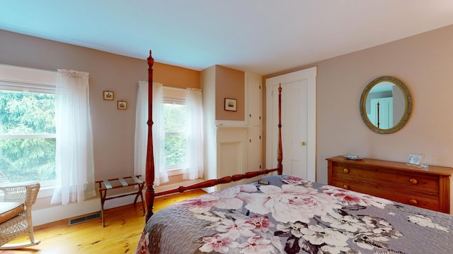 486 Webbs Mills Rd, Raymond, ME 04071 - bedroom featuring multiple windows and light wood-type flooring