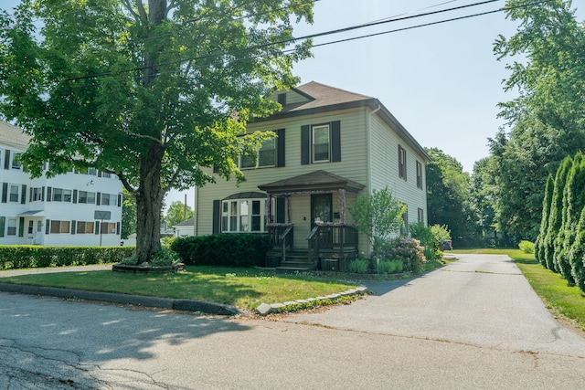 11 Gertrude Ave, Biddeford, ME 04005 - traditional style home with a front yard and concrete driveway