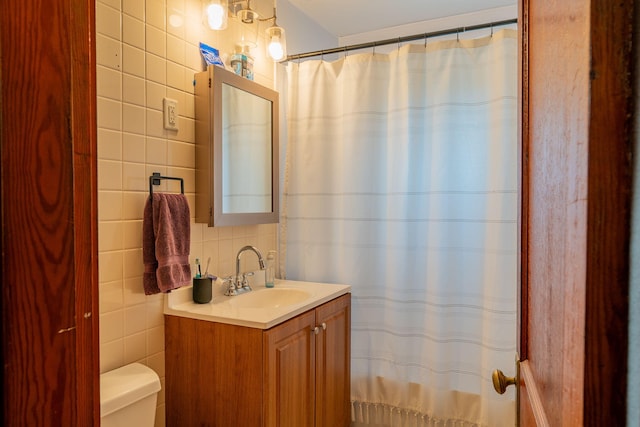 11 Gertrude Ave, Biddeford, ME 04005 - bathroom featuring tile walls, vanity, backsplash, and a shower with curtain