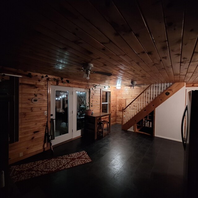 71 Mountain View Dr, Hartford, ME 04220 - unfurnished living room with stairs, wood walls, and wooden ceiling