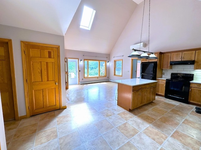 27 Hodgdon Rd, Levant, ME 04456 - kitchen with black appliances, under cabinet range hood, a skylight, light countertops, and high vaulted ceiling