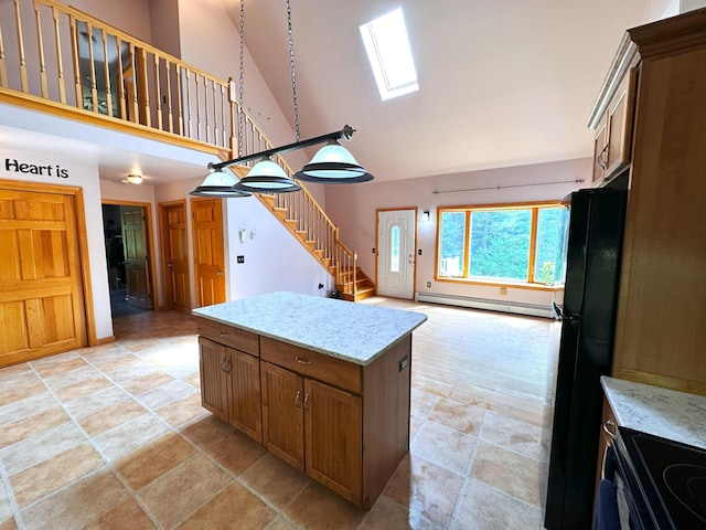 27 Hodgdon Rd, Levant, ME 04456 - kitchen featuring high vaulted ceiling, freestanding refrigerator, a baseboard radiator, range with electric stovetop, and light stone finish floors