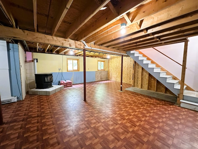 27 Hodgdon Rd, Levant, ME 04456 - basement with a wood stove and stairway