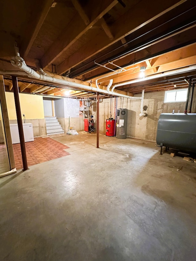 27 Hodgdon Rd, Levant, ME 04456 - below grade area featuring oil tank, electric water heater, stairs, and water heater