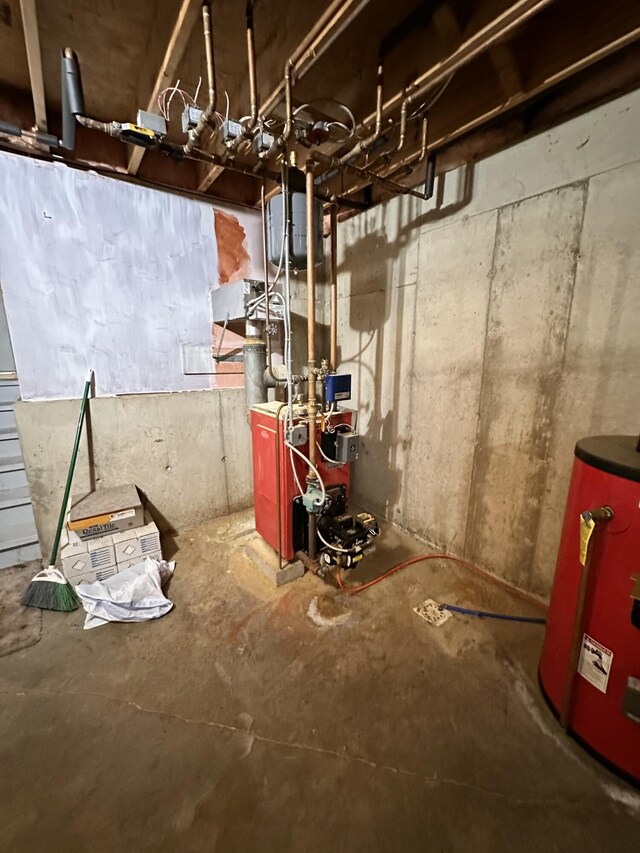 27 Hodgdon Rd, Levant, ME 04456 - unfinished basement featuring water heater and a heating unit