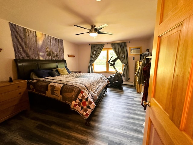 27 Hodgdon Rd, Levant, ME 04456 - bedroom featuring a baseboard heating unit, dark wood-style flooring, an AC wall unit, and ceiling fan