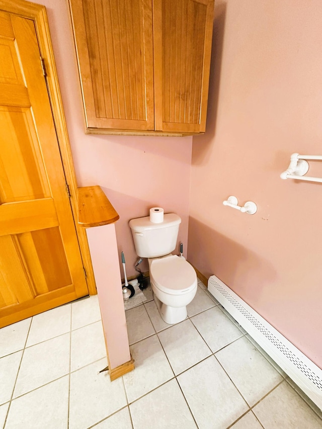 27 Hodgdon Rd, Levant, ME 04456 - bathroom featuring a baseboard heating unit and tile patterned flooring
