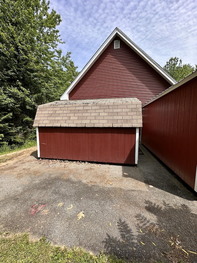 27 Hodgdon Rd, Levant, ME 04456 - view of home's exterior with a storage shed and roof with shingles
