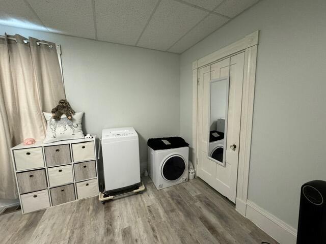 46 Cedar St, Dover-Foxcroft, ME 04426 - laundry room featuring washer and clothes dryer and wood finished floors