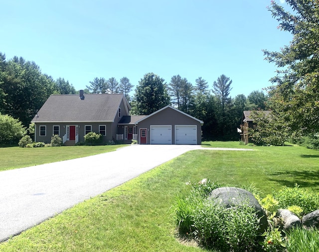 34 Cari Way, Sidney, ME 04330 - view of front facade with a front lawn, driveway, and an attached garage