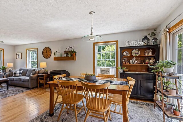 34 Cari Way, Sidney, ME 04330 - dining area with a textured ceiling, light wood-style flooring, and healthy amount of natural light