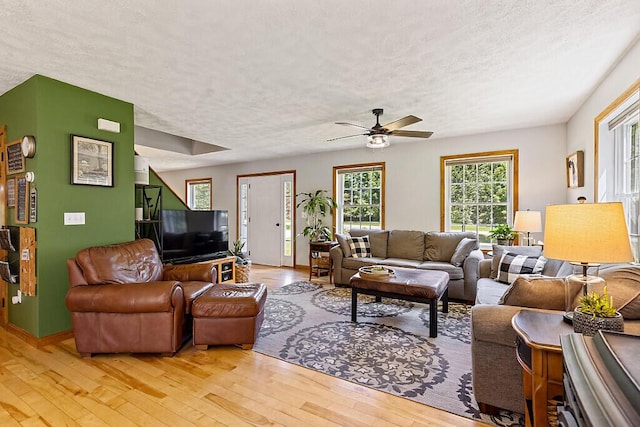 34 Cari Way, Sidney, ME 04330 - living area featuring a textured ceiling, light wood-type flooring, and ceiling fan