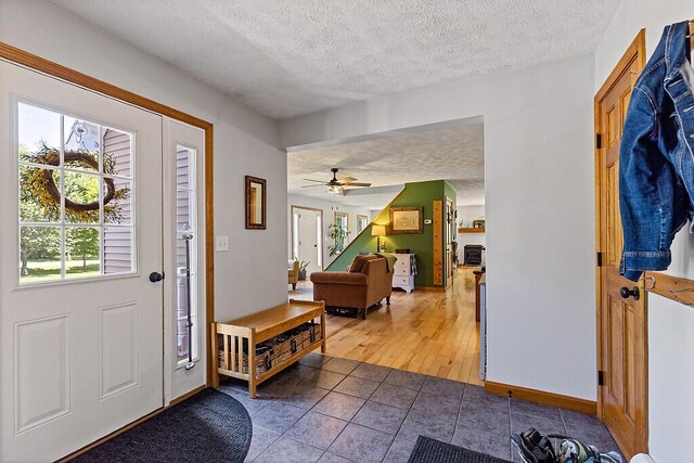 34 Cari Way, Sidney, ME 04330 - foyer entrance with a textured ceiling, tile patterned floors, and ceiling fan