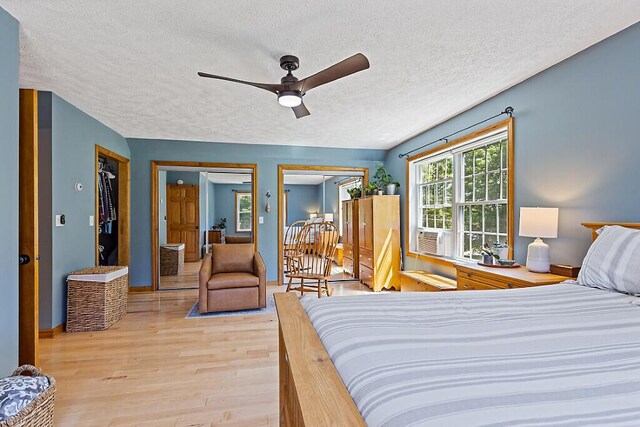 34 Cari Way, Sidney, ME 04330 - bedroom with a textured ceiling, light wood-type flooring, and a ceiling fan