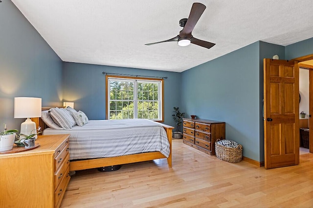 34 Cari Way, Sidney, ME 04330 - bedroom with light wood finished floors, a textured ceiling, and ceiling fan