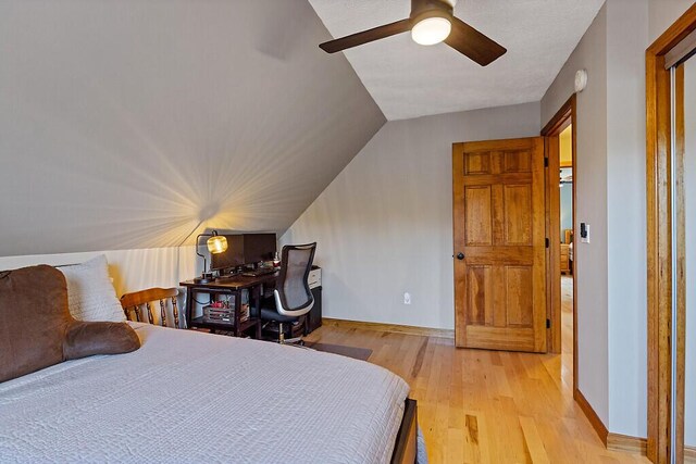 34 Cari Way, Sidney, ME 04330 - bedroom with light wood-style flooring, lofted ceiling, and a ceiling fan