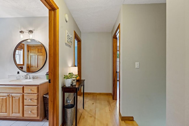 34 Cari Way, Sidney, ME 04330 - hall with a textured ceiling and light wood-type flooring