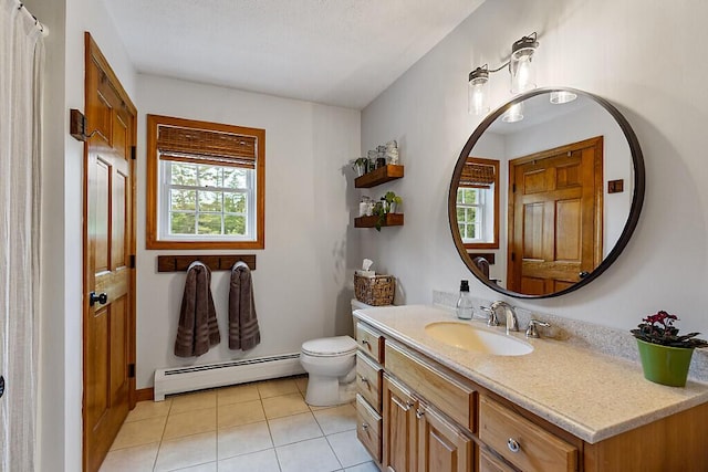 34 Cari Way, Sidney, ME 04330 - bathroom with a baseboard radiator, vanity, and tile patterned flooring
