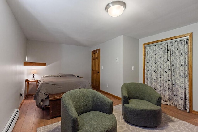 34 Cari Way, Sidney, ME 04330 - bedroom with a baseboard heating unit and wood finished floors