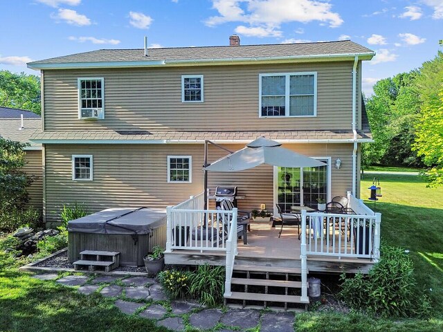 34 Cari Way, Sidney, ME 04330 - rear view of house with a hot tub, a lawn, a deck, and a chimney