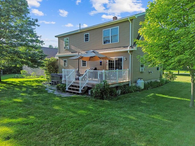 34 Cari Way, Sidney, ME 04330 - rear view of house featuring a lawn, a wooden deck, and a chimney