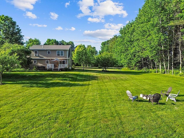 34 Cari Way, Sidney, ME 04330 - view of grassy yard with an outdoor fire pit
