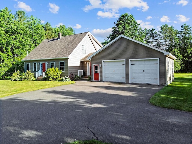 34 Cari Way, Sidney, ME 04330 - view of front of home with a chimney, a front lawn, and entry steps